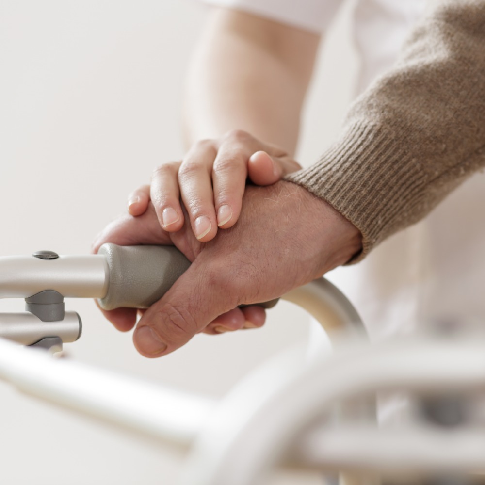 woman holding patients hands